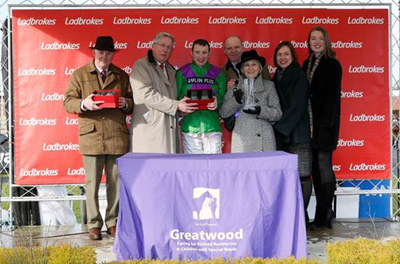 Mike O’Kane presenting mementoes to winning connections of Gala Ball, who won The Ladbrokes Supporting Greatwood Handicap Hurdle Race