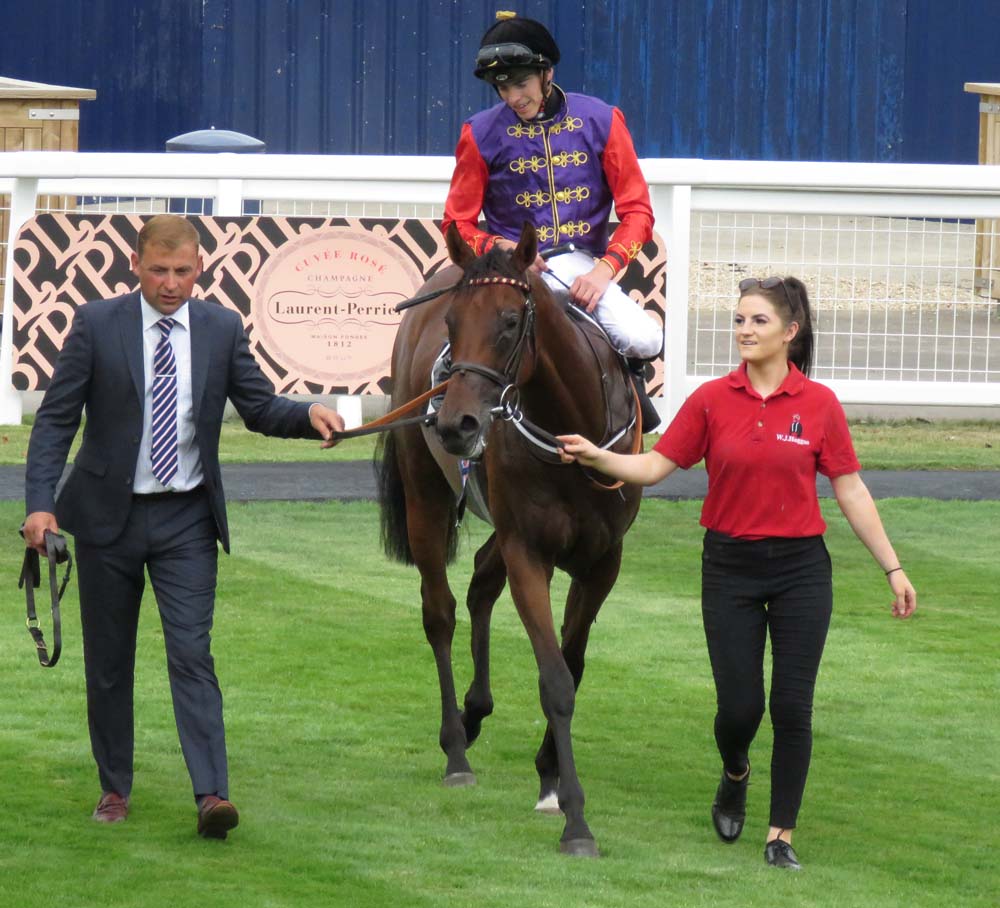 Newbury: HM the Queen's Magnetic Charm led into the winner's enclosure