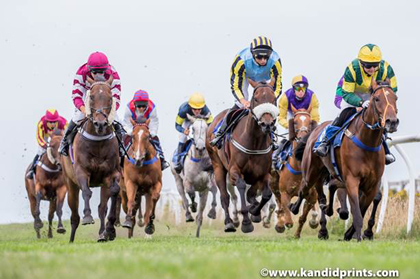 James Paget second left in cerise and white stripes
